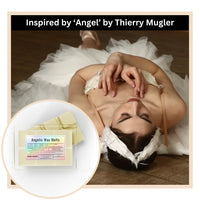 Thumbnail for Woman in a white dress with 'Angel' by Thierry Mugler branding, featuring angelic wax melts.