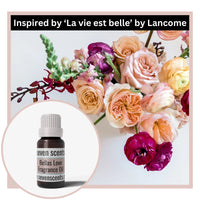Thumbnail for Floral arrangement with a bottle of Seven Scents Bella's Love fragrance oil, inspired by 'La vie est belle' by Lancome.