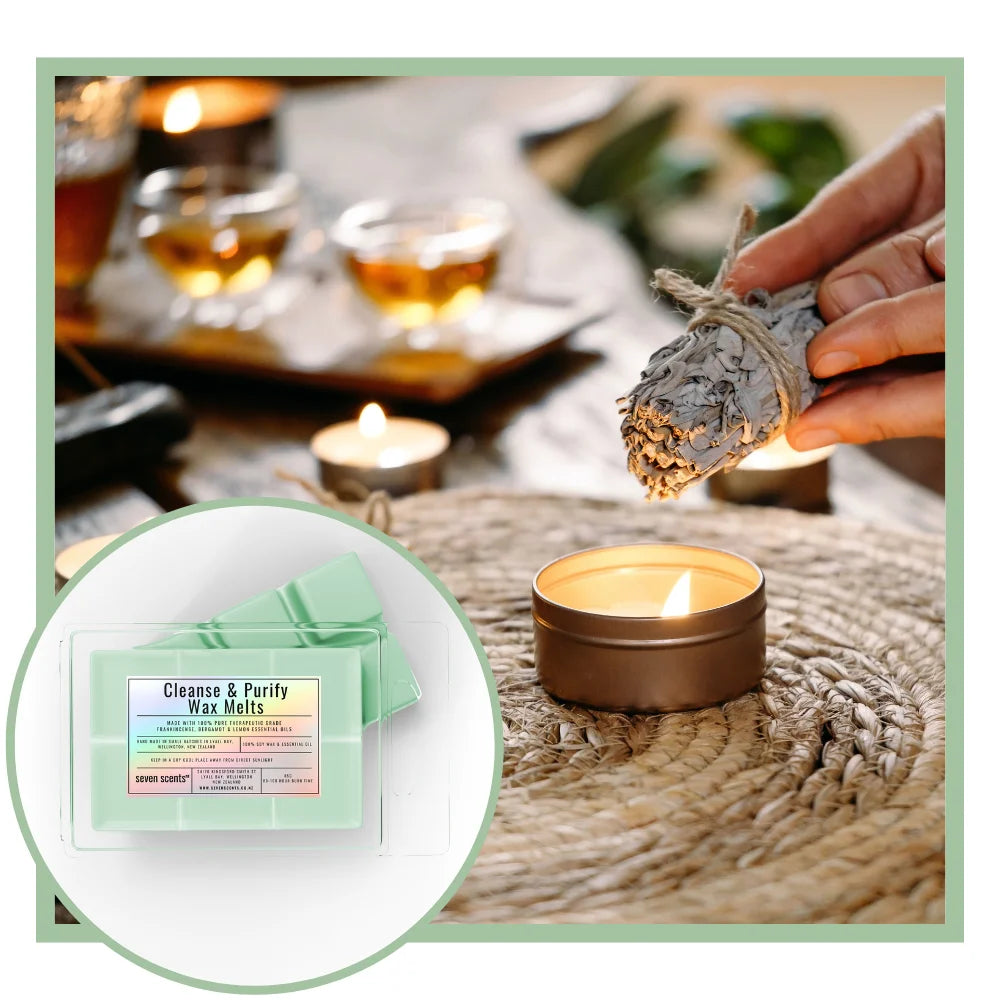 Candle with white sage cleansing and 'Cleanse & Purify Wax Melts' on a textured surface.