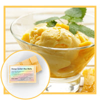 Thumbnail for Mango sorbet ice cream in a glass bowl with mango slices and leaves, accompanied by Mango Sorbet Wax Melts packaging.