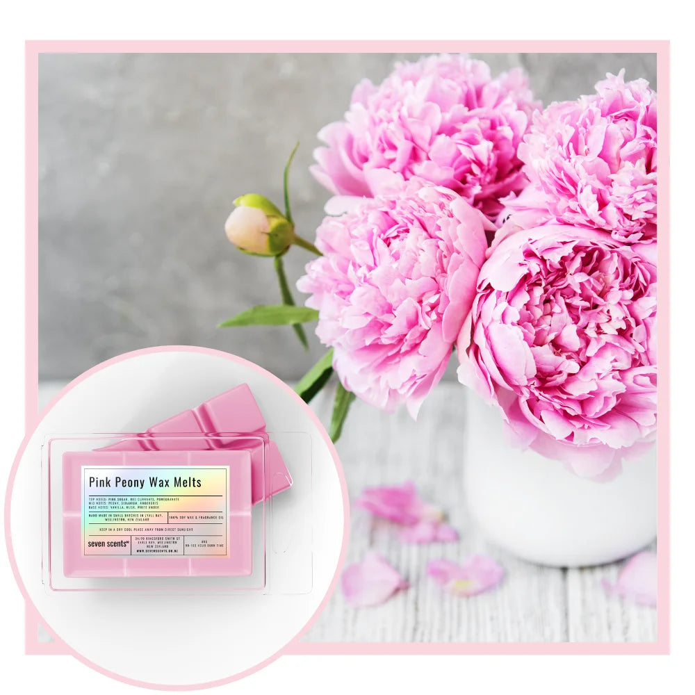 Pink peony wax melts with a vase of pink peonies on a gray background