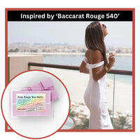Thumbnail for Woman in white dress on balcony with inset of Ruby Rouge wax melts packaging.