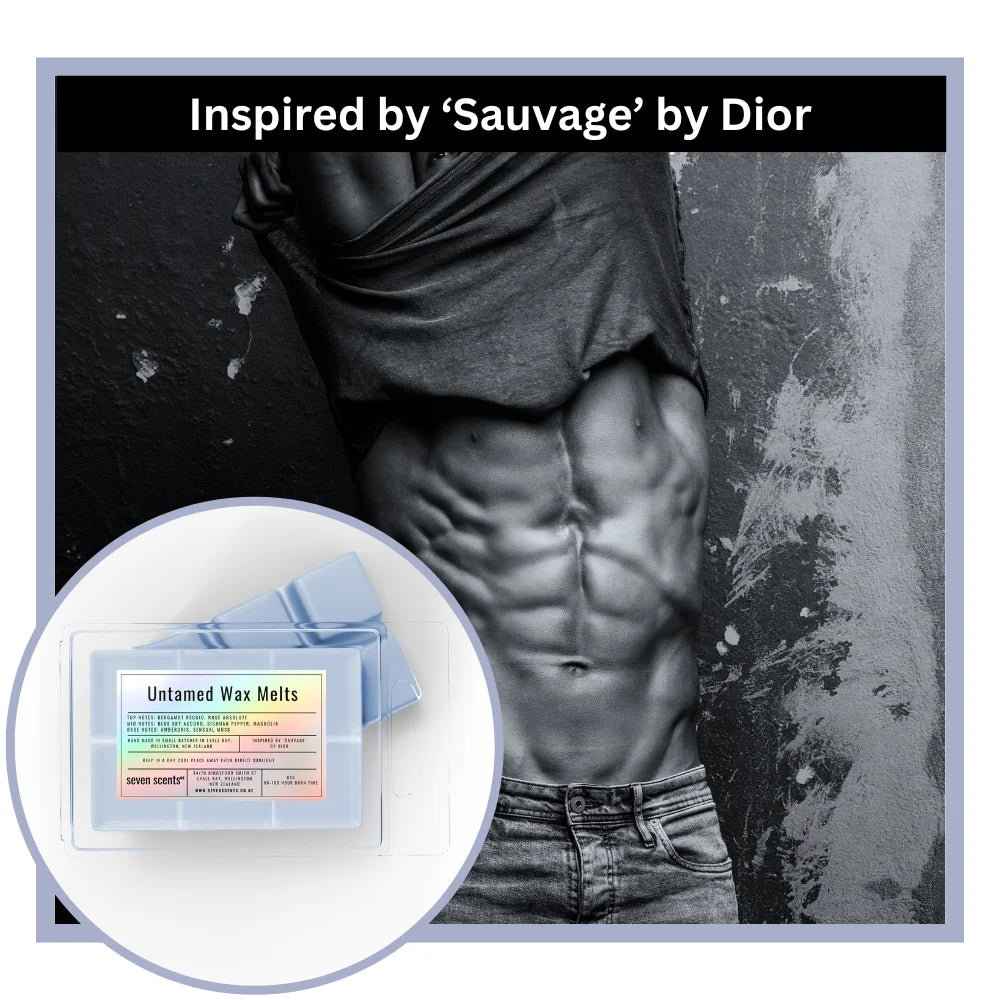 Man with a toned stomach wearing a gray shirt and jeans, with 'Untamed Wax Melts' packaging in the corner.
