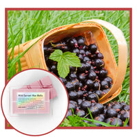 Thumbnail for Basket of black currants with a close-up of wild currant wax melts packaging on grass.